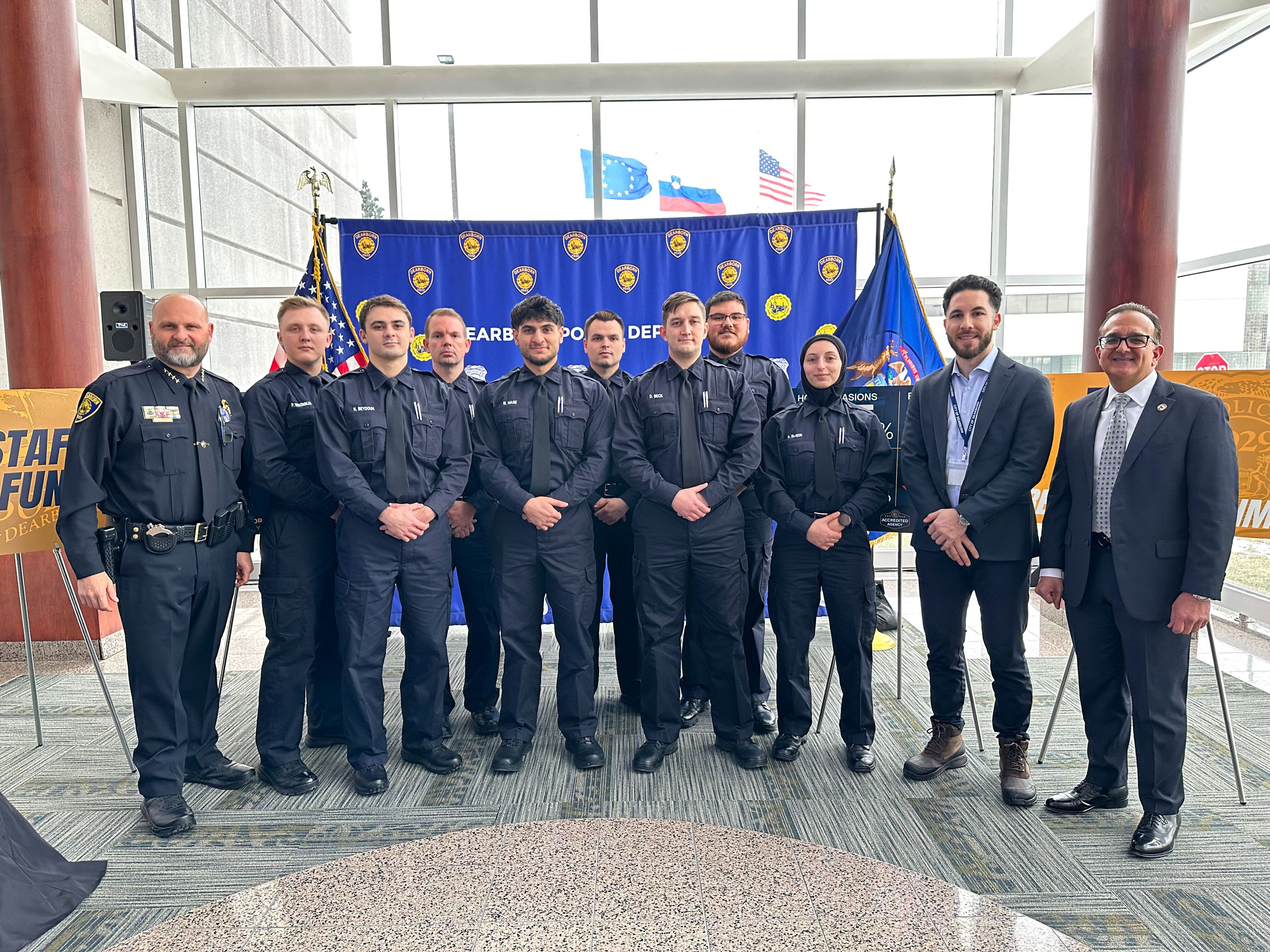 Photo caption: Dearborn Mayor Abdullah H. Hammoud, Council President Michael T. Sareini, and Police Chief Issa Shahin stand with new recruits to the Dearborn Police Department at an event announcing significant decreases in major crime at the Dearborn Administrative Center, Jan. 22, 2025.