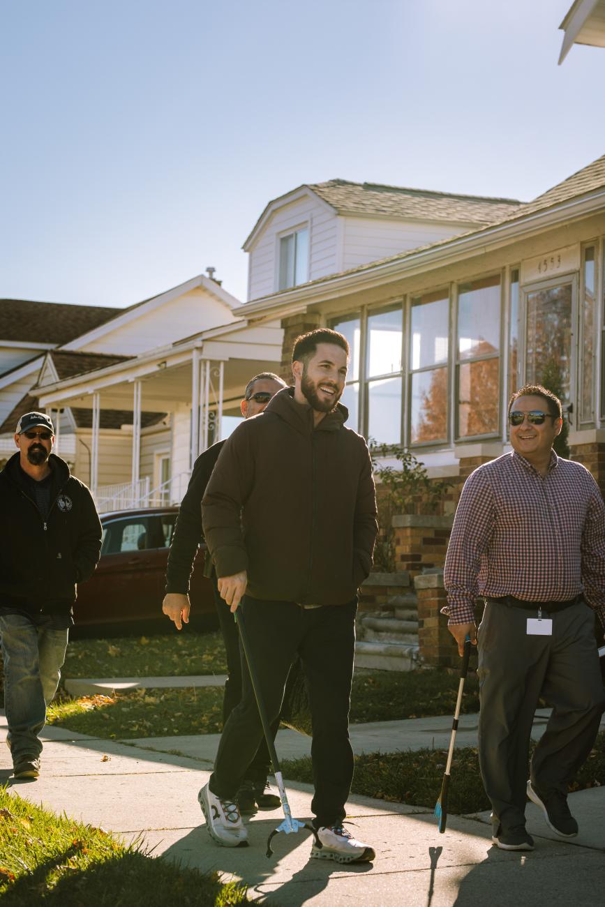 Mayor Hammoud walks with staff at a neighborhood Walk & Talk