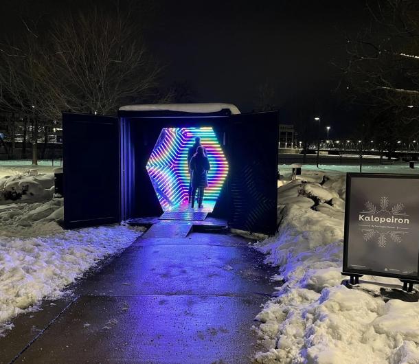 Giant illuminated, multicolor, hexagonal sculpture, Kalopeiron, created by artist Two Eagles.